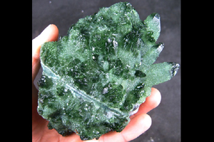 Quartz clusters, treated with another element, such as chromium, recrystallized.